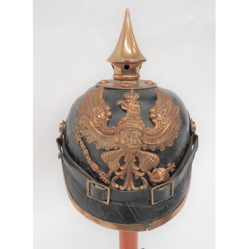 375 - Imperial German Prussian Infantry Pickelhaube 
black leather crown.  Attached front peak with brass ... 