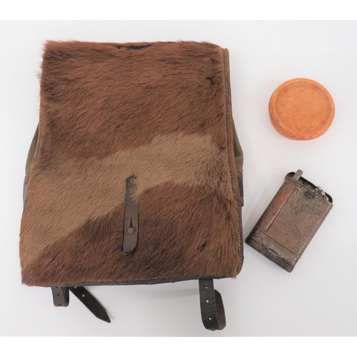 German Third Reich Pony Skin Rucksack
green canvas bag with leather framework dated 1942.  Pony skin front flap.  Together with alloy Luftwaffe cup ... Tan Bakelite soap dish ... K98 rifle cleaning kit in tin box ... 2 x first aid dressings. 