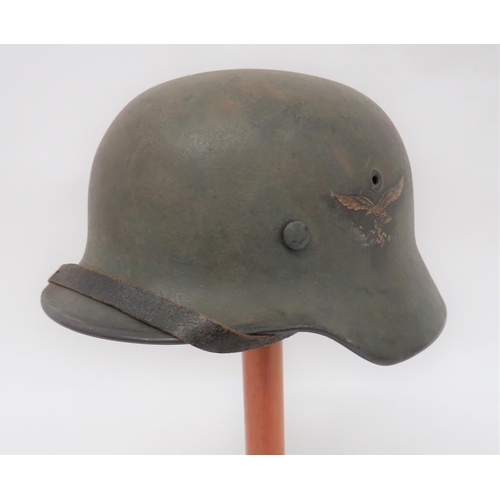 383 - Third Reich German M1940 Luftwaffe Steel Helmet
dark green overpainted steel shell around the Luftwa... 