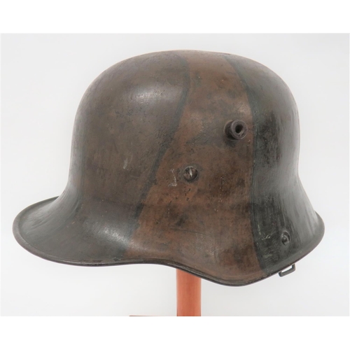 384 - Imperial German M1916 Camouflaged Battle Damaged Steel Helmet
steel crown with lower rolled brim. &n... 