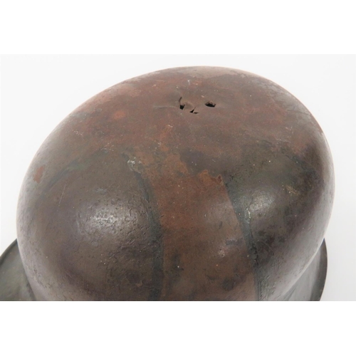 384 - Imperial German M1916 Camouflaged Battle Damaged Steel Helmet
steel crown with lower rolled brim. &n... 