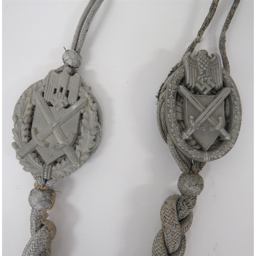 393 - Two German Third Reich Marksman Lanyards
twisted alloy cord lanyards.  The top overlaid with al... 