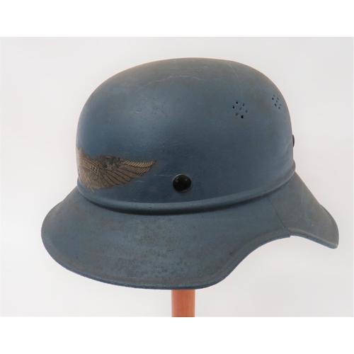 404 - Third Reich German Luftschutz Helmet
blue painted crown with lower seam and attached rolled edge, tw... 