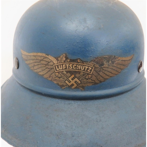 404 - Third Reich German Luftschutz Helmet
blue painted crown with lower seam and attached rolled edge, tw... 