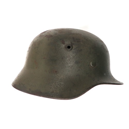 405 - Third Reich German Wehrmacht Combat Helmet
green painted steel shell with lower rolled edge brim.  I... 