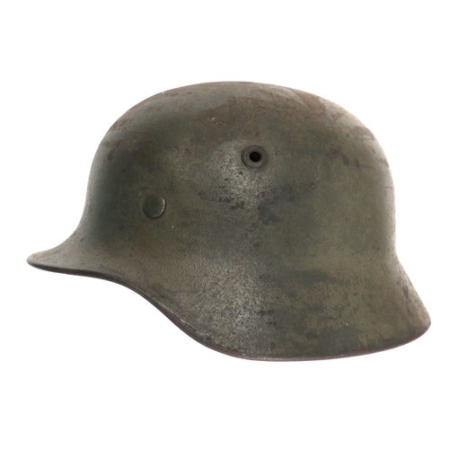 405 - Third Reich German Wehrmacht Combat Helmet
green painted steel shell with lower rolled edge brim.  I... 