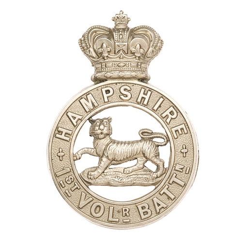 1st (Winchester) VB  Hampshire Regiment Victorian pouch badge circa 1885-1901.  Good scarce die-stamped white metal crowned circlet inscribed HAMPSHIRE  1ST VOLR. BATTN.; Tiger to voided centre. Three screw posts. VGC        Became 4th Battalion in 1908.