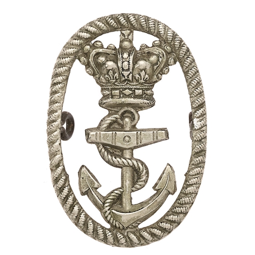 Naval Yard Police Victorian 1st pattern cap badge.  Good scarce die-stamped white metal roped oval with crowned fouled anchor to voided centre.    Toned loops.  VGC