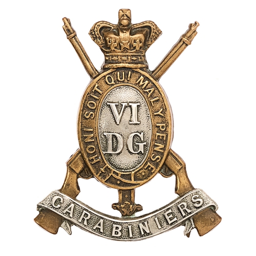6th Dragoon Guards (Carabiniers) Victorian cap badge circa 1896-1901.  Good die-cast brass crowned oval Garter on crossed carbines; VI over DG to white metal centre; CARABINIERS white metal scroll across the butts. Two toned loops. VGC
