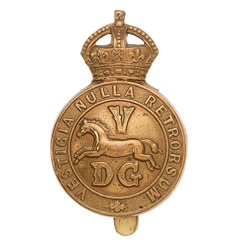 5th Dragoon Guards WW1 brass economy cap badge circa 1916-18.  Good scarce die-stamped brass crowned VESTIGIA NULLA RETRORSUM circlet,  centre bearing horse between V DG.     Slider.  VGC