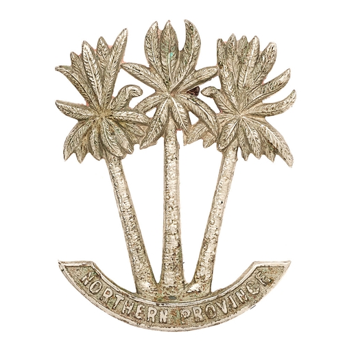 Sudan. Northern Province Police head-dress badge.  Good scarce die-cast white metal three palm trees resting on NORTHERN PROVINCE scroll.    Loops.  GC