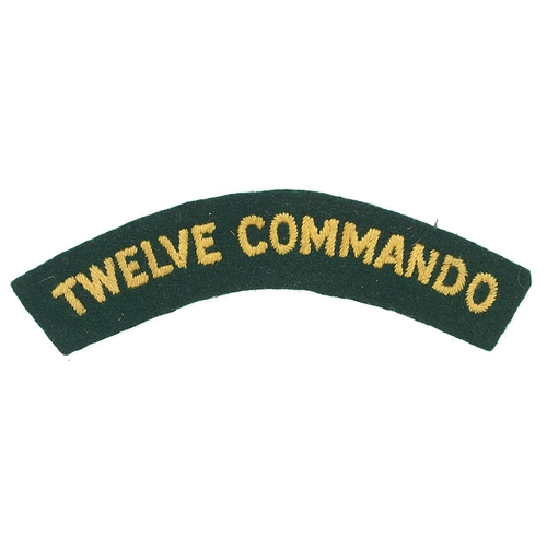 365 - TWELVE COMMANDO WW2 cloth shoulder title.  Good rare embroidered yellow sans-serif letters on green.... 