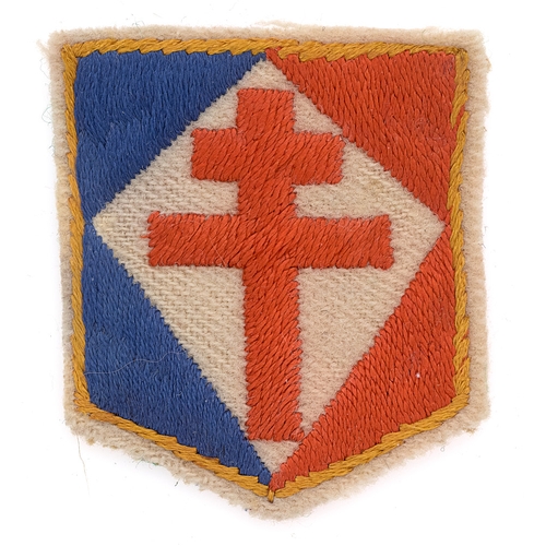 Free French Commando WW2 cloth beret badge.  Good rare golden edged white felt shield, the corners embroidered in blue and red with central white diamond bearing red Cross of Lorraine.       VGC