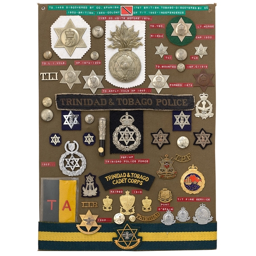 388 - 49 Trinidad and Tobago military and police badges etc.  Board with good display of metal and cloth b... 