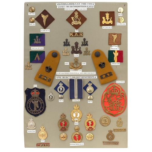 393 - 44 6th King's African Rifles and Tanganyika Police badges etc.  Board with good display of metal and... 