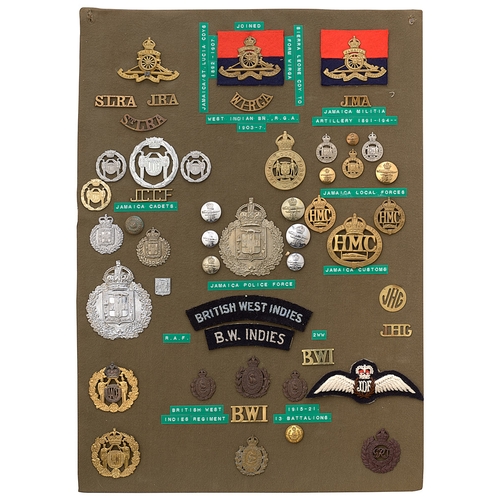 401 - 49 Jamaica military and police badges etc.  Board with good display of metal and cloth badges, butto... 