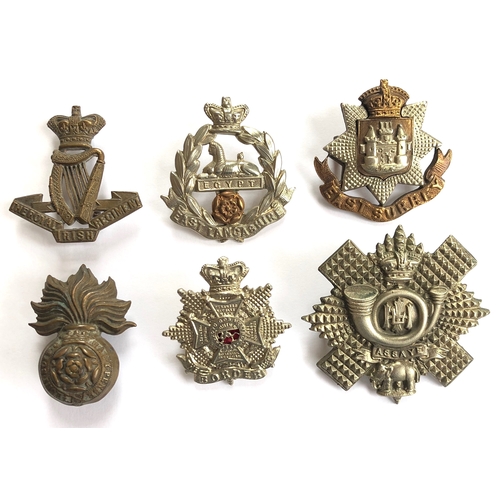 456 - 6 Victorian Infantry cap badges.  Royal Irish ... East Lancashire ... East Surrey ... Royal Fusilier... 