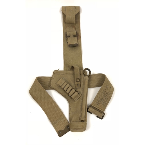 WW2 1941 Tank Crew special pattern holster.  A good scarce 1941 dated example of the webbing tank crew holster. The open top holster has loops for six rounds of ammunition and retains long hanging strap with 1941 stamp, also with faint issue stamps to the rear of the holster.