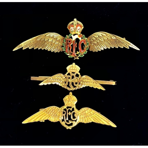 3 Royal Flying Corps Regimental Gold Sweetheart Brooches. Three examples depicting the RFC pilot wings. comprising: Yellow metal (probably high grade gold) and enamel. Damage to enamel of RFC and wreath. Width Approximately 56mm Gold stamped 9ct to the reverse. Width Approximately 43mm Gold Stamped 9ct to the reverse mounted onto a bar. Width Approximately 4cm (3 items)