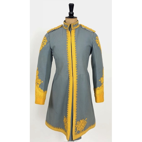 Indian Golconda Lancers Hyderabad State Forces Kurta.  A rare example tailored in pale blue cloth with yellow facings to the cuffs. Edged with yellow mohair lace and decorated with yellow mohair cord to the cuffs and collar. Complete with shoulder cords and full cloth lining. Colours remain good, some minor age wear.