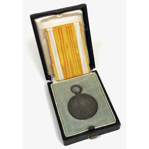 German Third Reich cased Life Saving Medal in silver.  Fine scarce example. The obverse bearing eagle with swastika in a shield on its breast; reverse with FUR RETTUNG AUS GEFAHR in oaf wreath. Housed in  fitted case with length FÜR RETTUNG AUS GEFAHR of ribbon. VGC