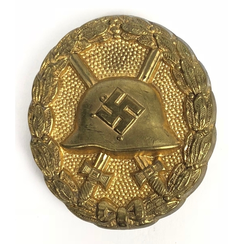 240 - German Third Reich 1937-39 Wound Badge in gold.  A good scarce die-cast gilded example. Reverse reta... 