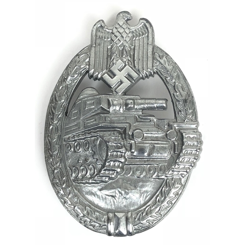 German Third Reich WW2 Army / Waffen SS Tank/Panzer Assault Badge. Good die-cast silvered zinc example. Approaching Panzer within an oval oakleaf wreath surmounted by eagle and swastika. Reverse retains hinged vertical round pin and securing hook. No maker mark. VGC Instituted 20th December 1939.