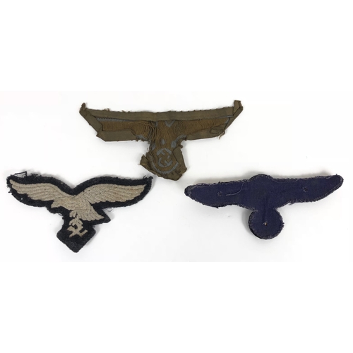 327 - 3 x German Third Reich breast eagles.  Afrika Korps (well worn) ... Luftwaffe ...  Kriegsmarine unus... 