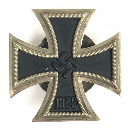 German Third Reich 1939 Iron Cross 1st Class, screwback, by Hymmen & Co., Ludenscheid.  Good silvered frame set and magnetic iron centre, with ribbed retaining disc to reverse which is impressed L/53. Small spike to reverse of top arm to prevent award rotating on tunic. Service wear. GC