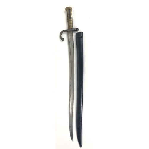 1871 Dated French Chassepot Bayonet.  Single edged Yataghan blade with large fuller. The hilt with steel hook quillon,  muzzle ring and brass ribbed grip.  Steel locking spring and stud.  Housed in its steel scabbard. The back of the blade with ordnance stamps and date 1871. GC