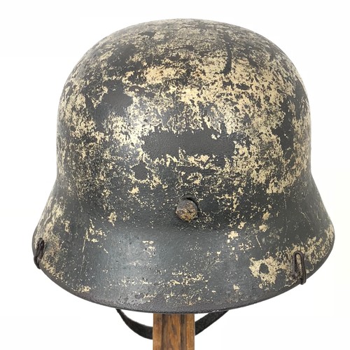 382 - German Third Reich Combat Steel Helmet.  This example with rolled edge example retaining traces of a... 