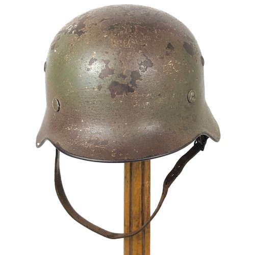 375 - German Third Reich Camouflage Combat Steel Helmet. A scarce rolled edge example retaining the origin... 