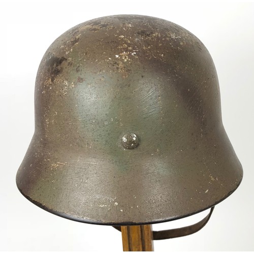 375 - German Third Reich Camouflage Combat Steel Helmet. A scarce rolled edge example retaining the origin... 