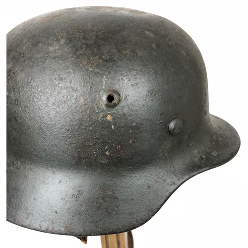 357 - German Third Reich Single Decal Steel Helmet.  A scarce rolled edge example with gold coloured eagle... 