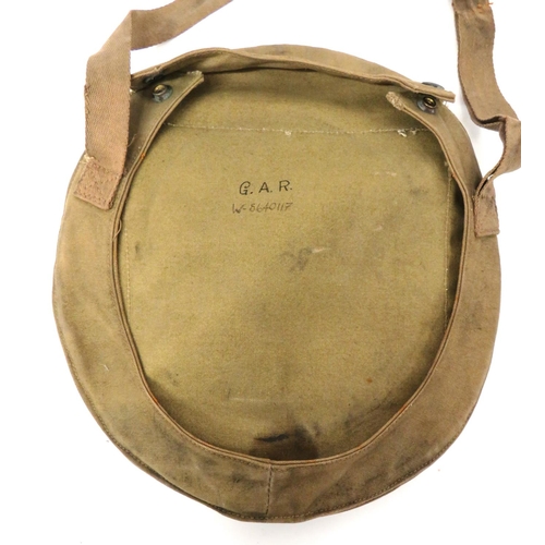 191 - WW2 Home Front Helmet Carrier Bag And Helmet
khaki canvas rim secured carrier.  The rear with s... 