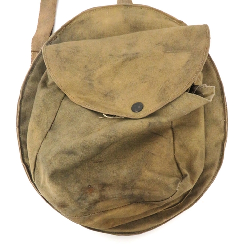 191 - WW2 Home Front Helmet Carrier Bag And Helmet
khaki canvas rim secured carrier.  The rear with s... 