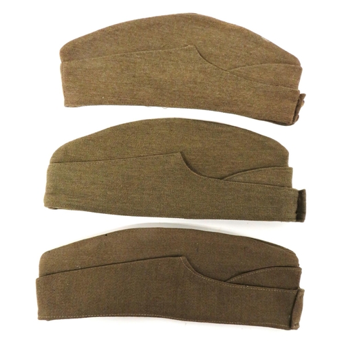 195 - Three Field Service Caps
consisting 2 x khaki Other Ranks examples.  Brass, General List front ... 