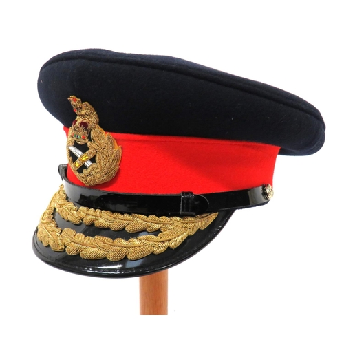 Post 1953 General's Dress Cap
dark blue crown and body.  Red band with bullion embroidery, QC, General's cap badge.  Black patent peak with two rows of bullion embroidery oak leaves.  Black chinstrap secured by anodised General buttons.  Leather sweatband.  Crown with maker "Herbert Johnson".  Clean condition.