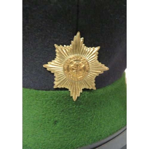 214 - Seven Various Guards Dress Caps
consisting dark blue with white band and piping Coldstream Guards ..... 