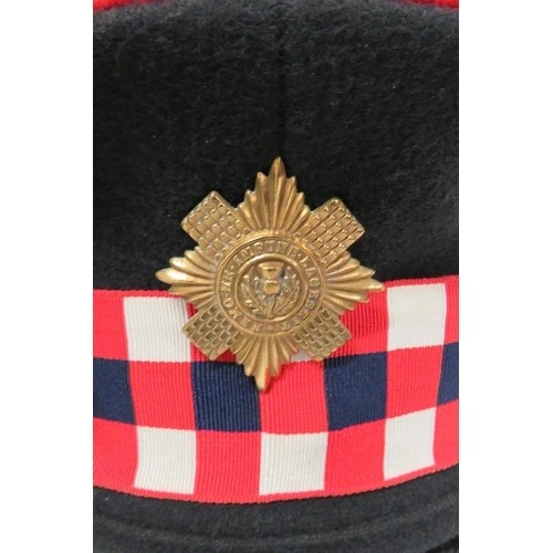 214 - Seven Various Guards Dress Caps
consisting dark blue with white band and piping Coldstream Guards ..... 