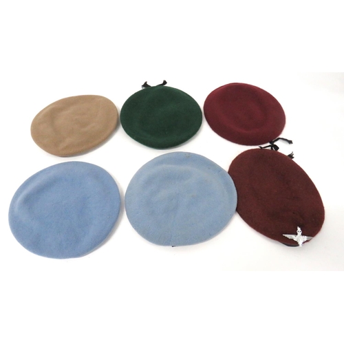 215 - Six Post War British Berets
consisting 2 x maroon examples.  One complete with anodised, QC Par... 