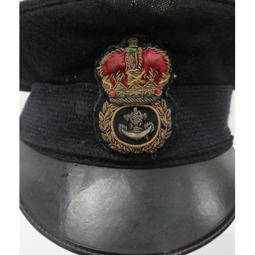 218 - Four Royal Navy Caps
consisting dark blue, Chief Petty Officer cap.  Bullion embroidery CPO bad... 