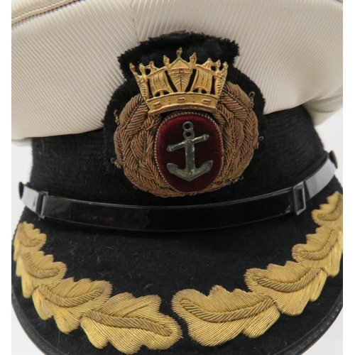 219 - Four Navy Officer Caps
consisting Merchant Navy Captain's example.  White top.  Black body... 