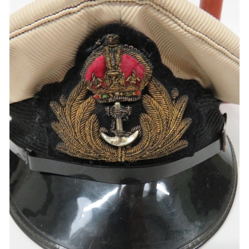 219 - Four Navy Officer Caps
consisting Merchant Navy Captain's example.  White top.  Black body... 