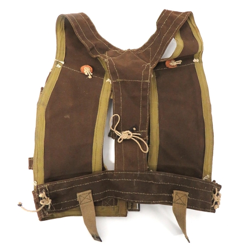 222 - WW2 Skeleton Assault Jerkin
brown canvas, double Bren magazine pouches fixed to shoulder Y strap and... 