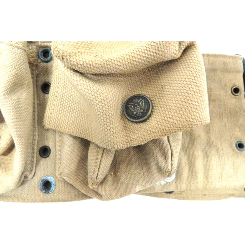 232 - Two American Ammunition Belts
consisting light khaki tan webbing, M1918, nine pouch cartridge belt. ... 