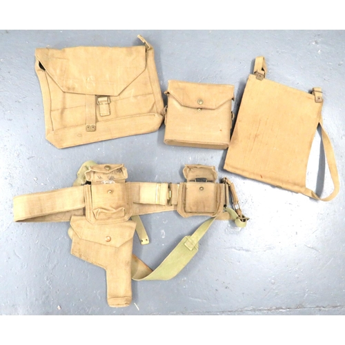 1937 Pattern Officer's Webbing Belt
consisting webbing belt ... Pair of shoulder straps ... Revolver holster ... Pistol ammunition pouch ... Compass case and compass ... Binocular case ... Map case ... Officer's side bag.  Some items blancoed.  Various wartime dates.  