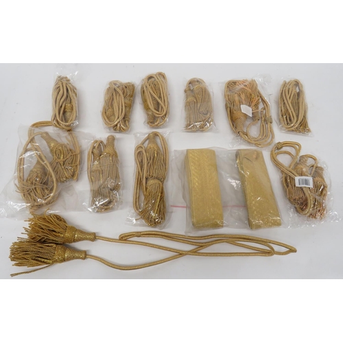 274 - Eleven Gilt Cord Tassels
current gilt cord with lower end, gilt wire tassels.  Together with 3 ... 