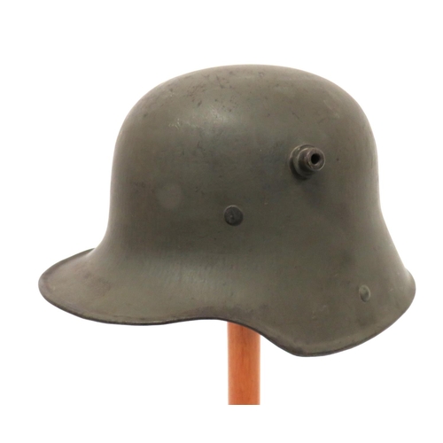 335 - Imperial German M1916 Steel Helmet
green painted crown of typical form with lower rolled edge brim. ... 