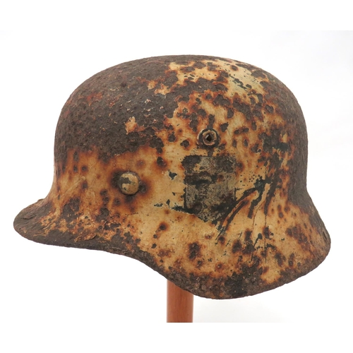 338 - German Third Reich Winter Camouflaged Wehrmacht Excavated Helmet
M1940 steel helmet with lower rolle... 